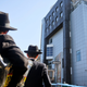 Jewish men stand outside Brooklyn’s Jewish Children’s Museum after a bomb threat on March 9, 2017. Photo: AP